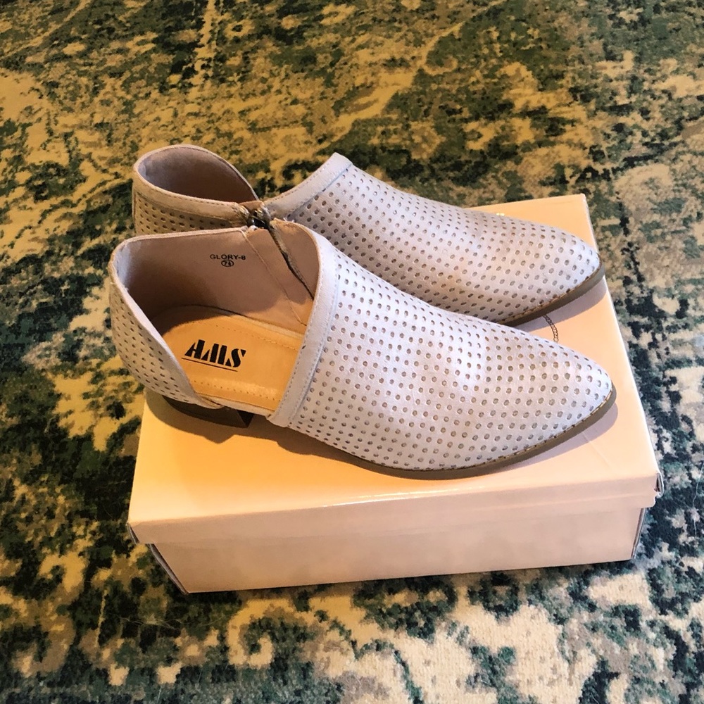 Brand new booties with cut out sides